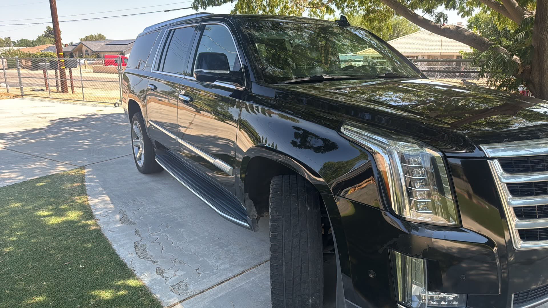 Black Cadillac Escalade with a mirror-gloss finish after a full detail by Maurice's