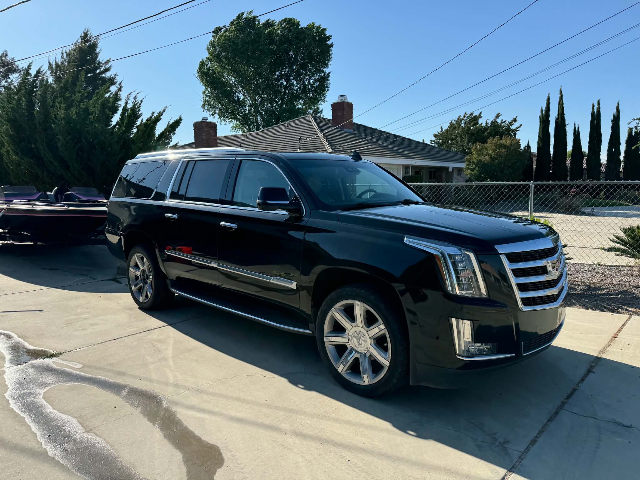 Black Cadillac Escalade ESV detailed inside and out — The Works package